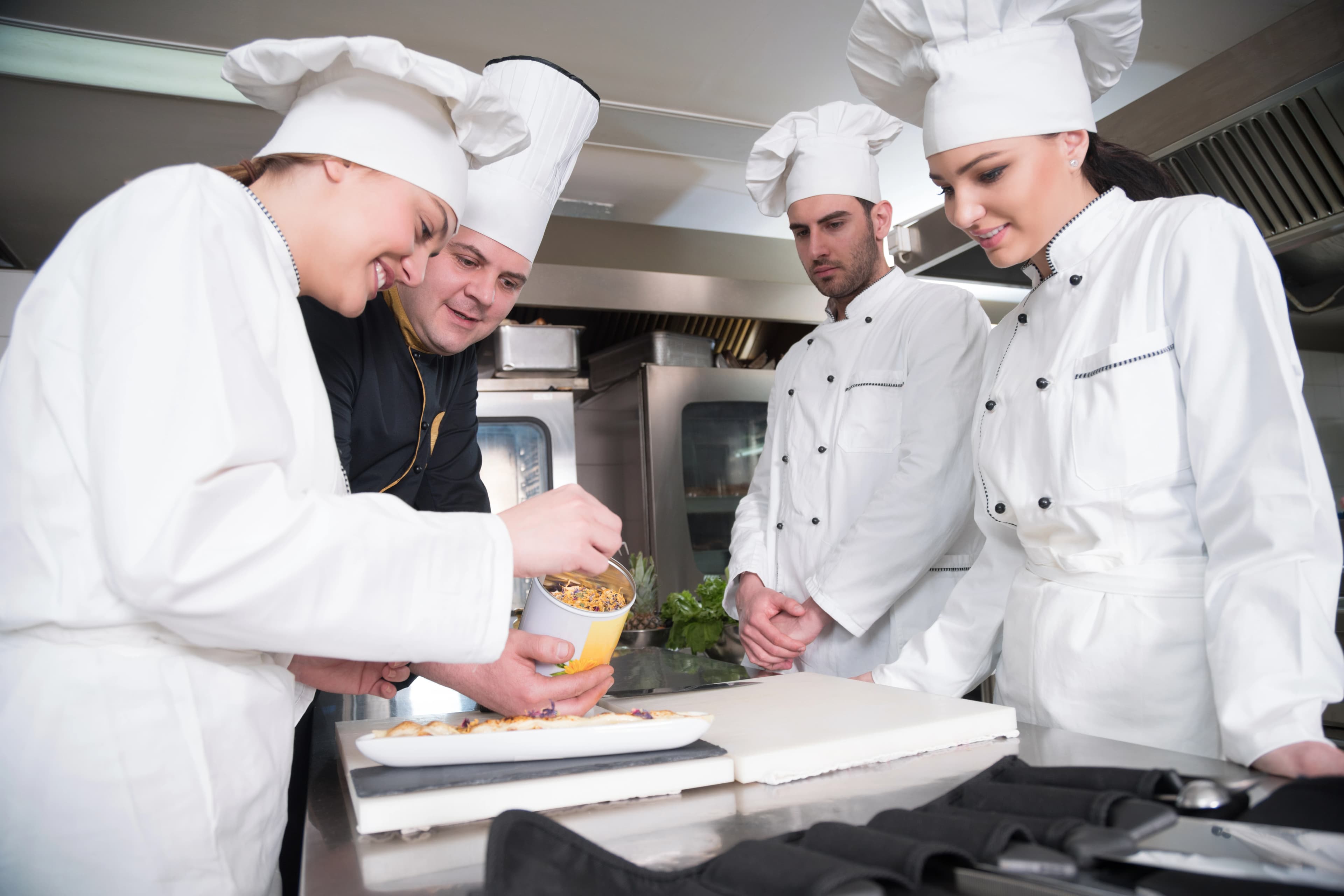 Chef teaching student